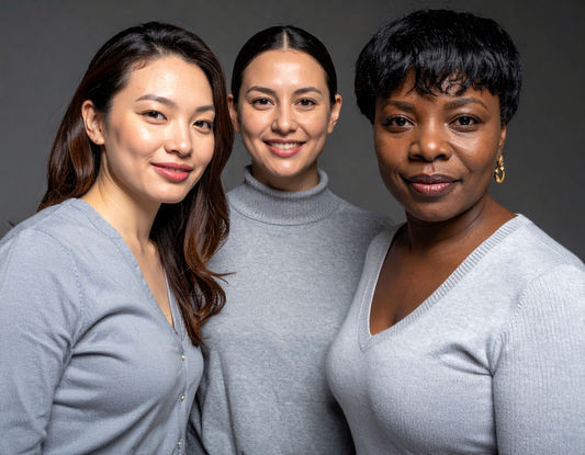 Three women wearing gray symbolizing Brain Tumor Awareness Month with supportive community